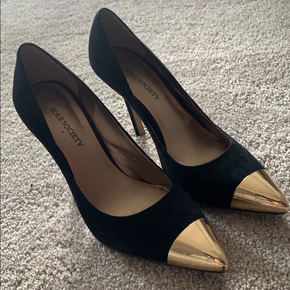 Black heels with gold toe